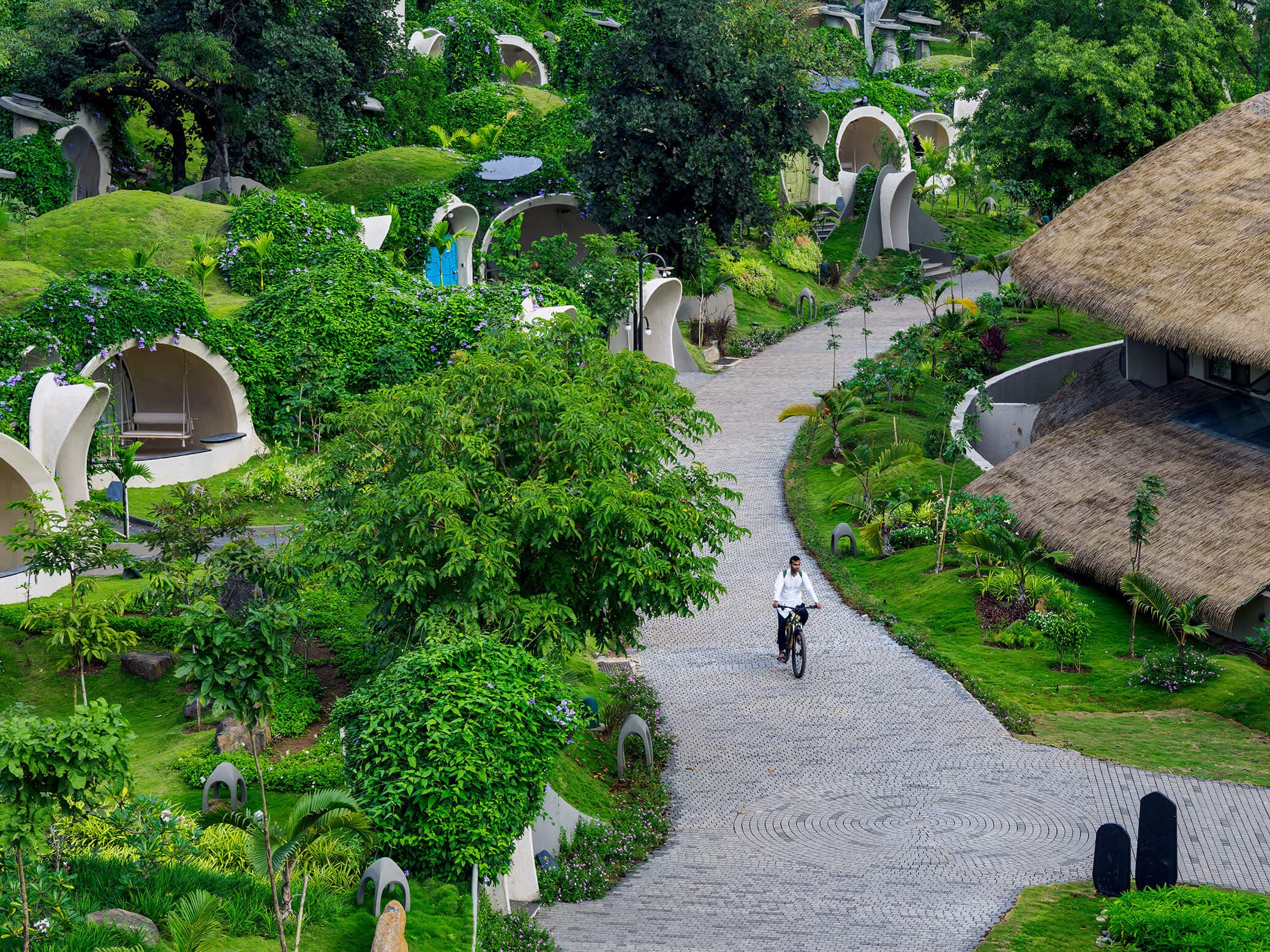 Pathway at Sukh Vihar, near Mumbai, surrounded by greenery, a wellness retreat near Mumbai.