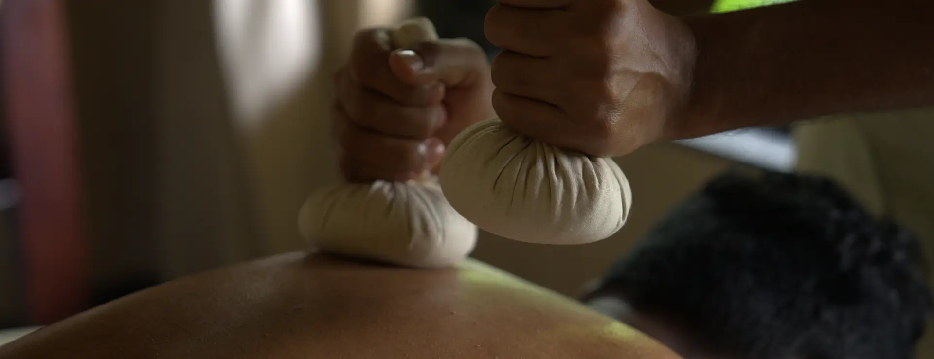 Person receiving traditional Panchakarma treatment at swastik luxury sanctuary, detoxification and rejuvenation therapies.