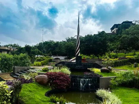 img_7039 Shiv Kund fountain, a notable landmark at Swastik Utsav Vihar Pune, enhances ambiance in the wellness retreat.