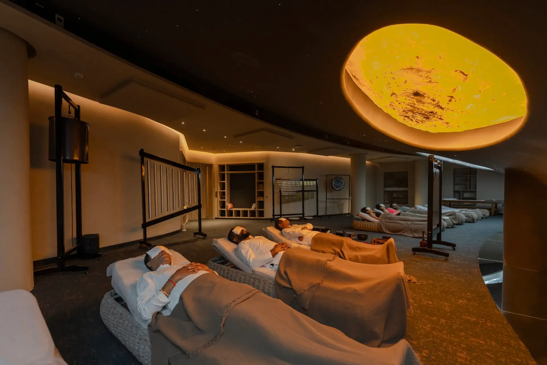 Sound healing in Ninadika Sonorium at Swastik Anand Vihar, providing relaxation and rejuvenation in a luxury wellness center setting.