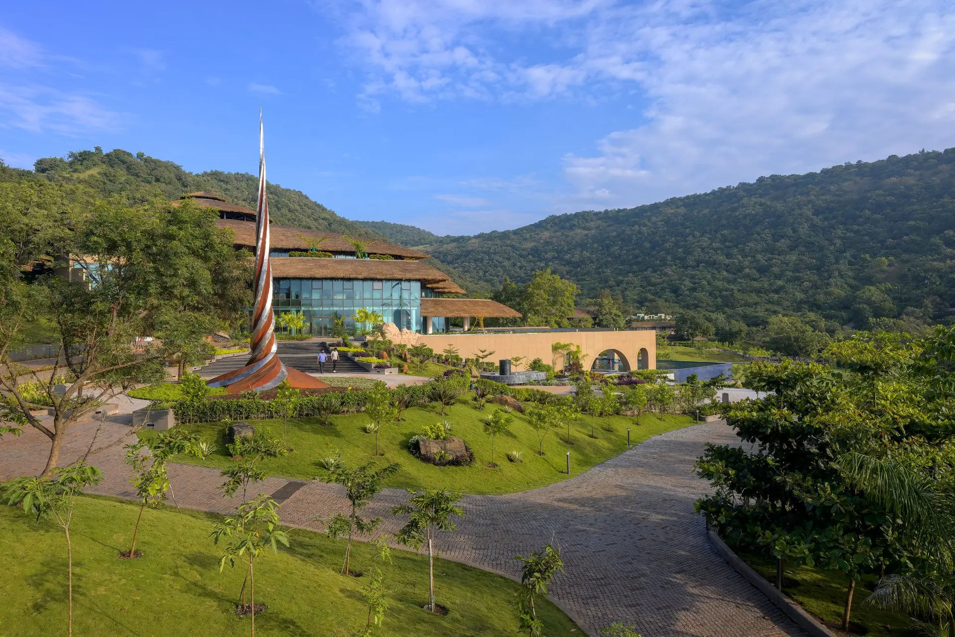 Utsav Vihar's open amphitheater, lush greenery, and scenic backdrop offer luxury health and wellness activities near Pune.