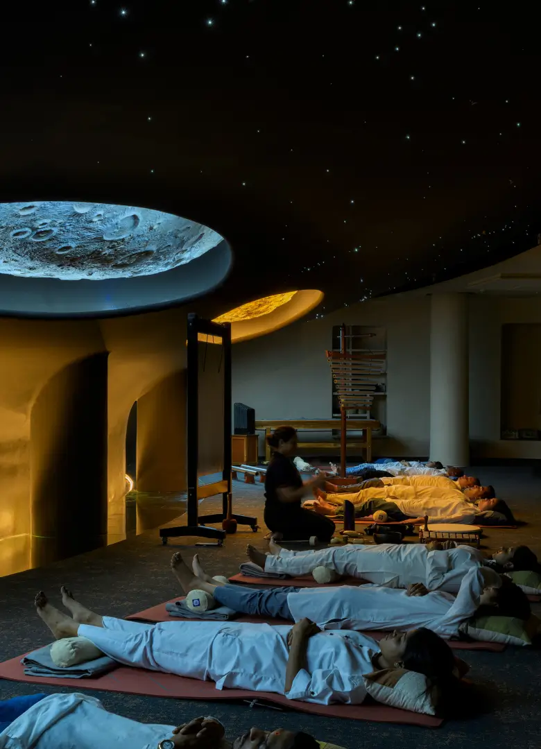 Guests in a cosmic sound healing therapy session