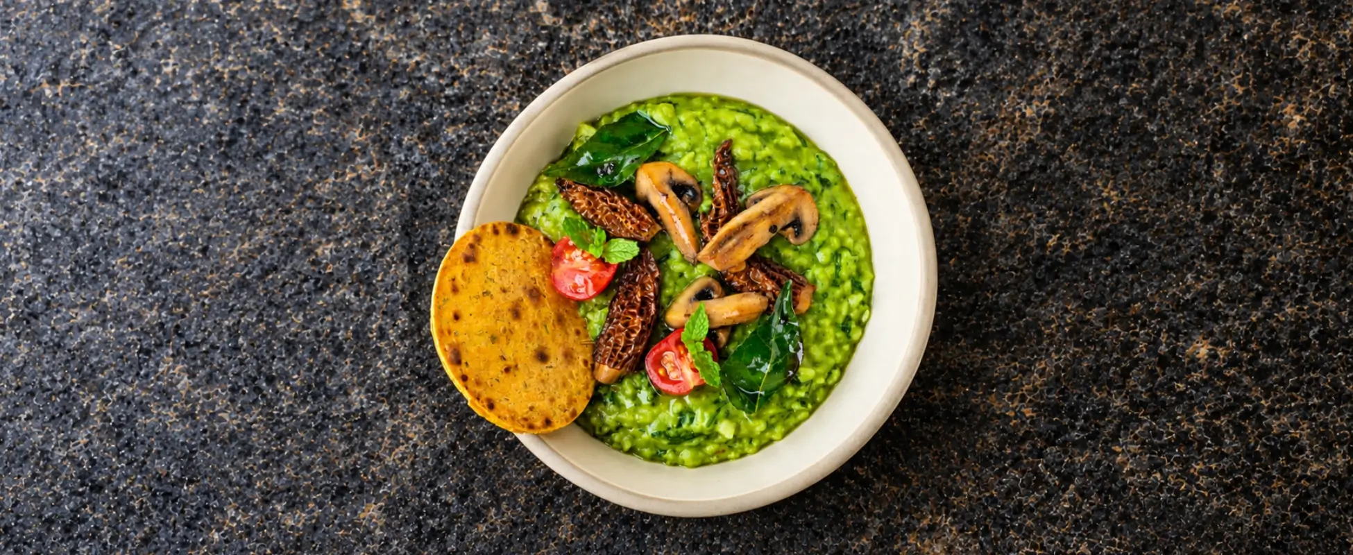 Diwali Detox: Reset Before and After the Festive Season Green spinach khichdi with morels, mushrooms and cherry tomatoes, served with roti for a light Diwali detox meal